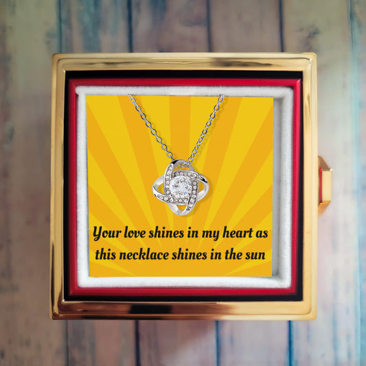 LOVE KNOT NECKLACE WITH ROTATING ROSE GIFT BOX AND MESSAGE CARD
